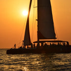 Santorini luxury catamaran sunset cruise with yacht BBQ and drinks