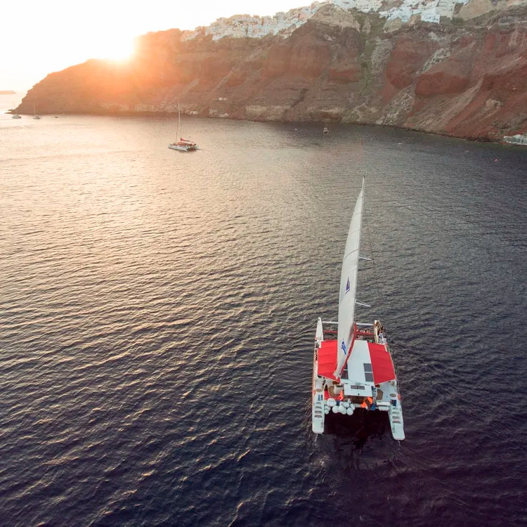 Santorini luxury catamaran sunset cruise with yacht BBQ and drinks