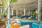 Barcelo Anfa Casablanca hotel lobby with contemporary blue velvet sofas, armchairs, plants, and patterned carpet