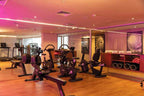 Barcelo Anfa Casablanca hotel gym with modern black cardio machines, weights, mirrors, and wooden flooring