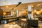 Barcelo Anfa Casablanca hotel restaurant with contemporary black buffet counters, marble surfaces, and floral display
