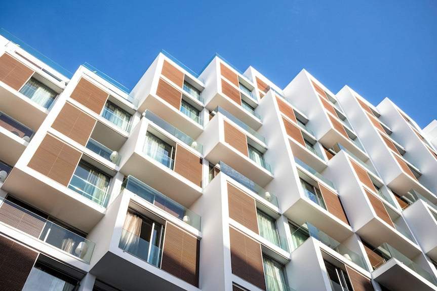 Barcelo Anfa Casablanca hotel with modern white facade, geometric balconies, and warm wood-look panels