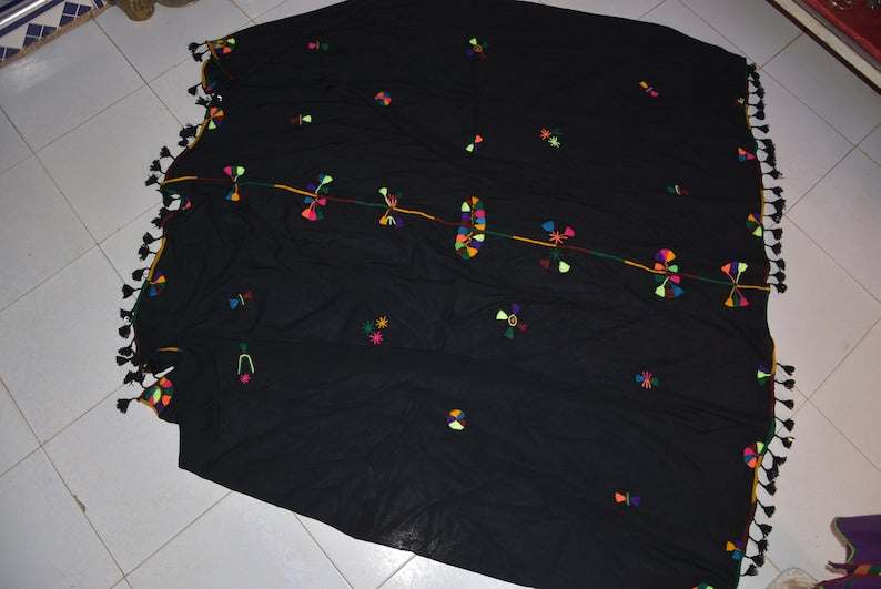 Berber Scarf Embroidery in black cotton and wool with colorful geometric embroidery and tassels along the edges.
