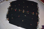 Berber Scarf Embroidery in black cotton and wool with colorful geometric embroidery and tassels along the edges.