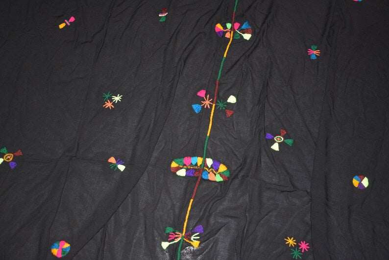 Black cotton and wool Berber Scarf Embroidery with colorful geometric and tribal motifs scattered evenly across the fabric.