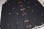 Black cotton and wool scarf with colorful geometric embroidered motifs and tassels along the edge, featuring Berber Scarf Embroidery.