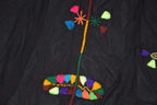 Berber Scarf Embroidery on black cotton and wool fabric featuring colorful floral and geometric patterns in vibrant threads.