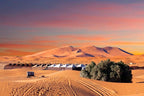 From Marrakech: To Sahara Tour showing orange desert dunes, mountain landscape, and rows of traditional tents