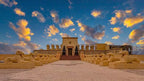 From Marrakech: To Sahara Tour featuring a sandstone Egyptian-style temple entrance lined with sphinx statues