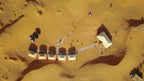 Hotel Kasbah Ksar Bicha aerial view of sand-colored tents and structures connected by paths in the desert landscape