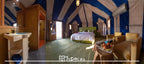 Hotel Yasmina Merzouga luxury tent room with green carpet, olive green bed, beige armchairs, blue and white striped tent interior