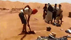 Merzouga Sand Baths showing people in traditional desert clothing preparing warm, golden sandy terrain for a wellness ritual in Sahara dunes.