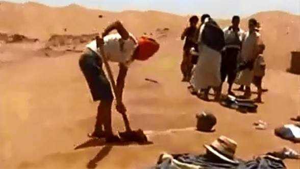 Merzouga Sand Baths showing people in traditional desert clothing preparing warm, golden sandy terrain for a wellness ritual in Sahara dunes.