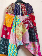 Merzouga Shopping Aladdin pants with colorful patchwork patterns including floral, paisley, chevron, and bandana prints in a boho harem design