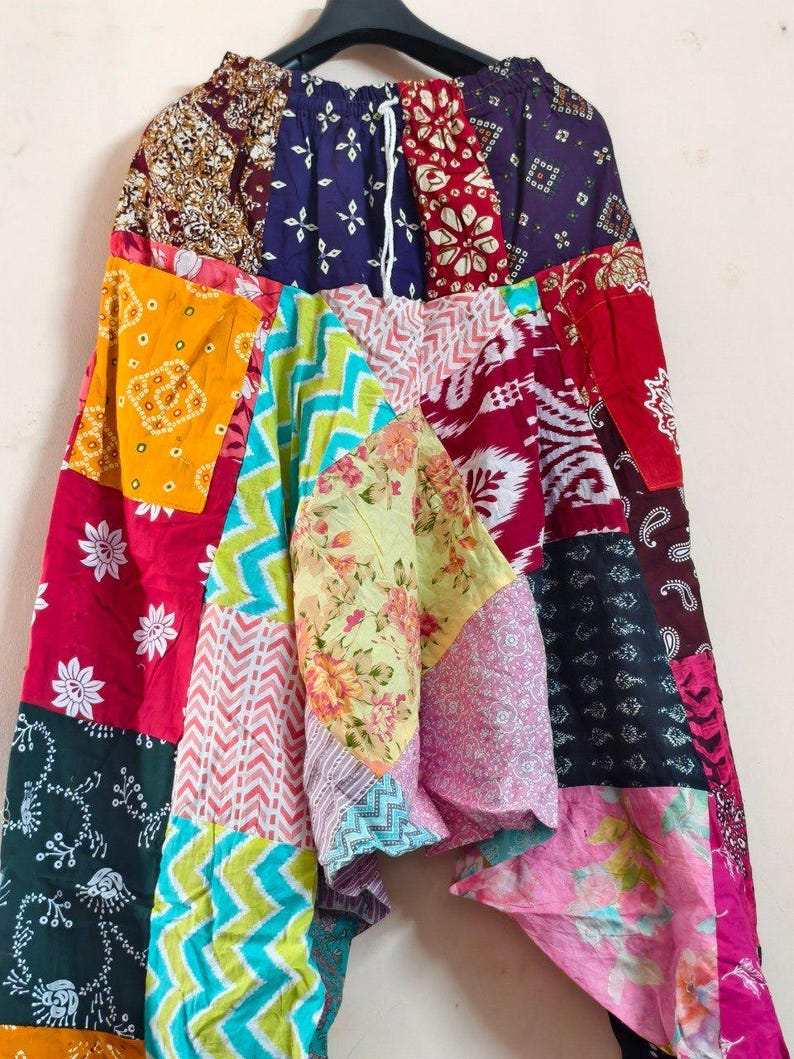 Merzouga Shopping Aladdin pants with colorful patchwork patterns including floral, paisley, chevron, and bandana prints in a boho harem design