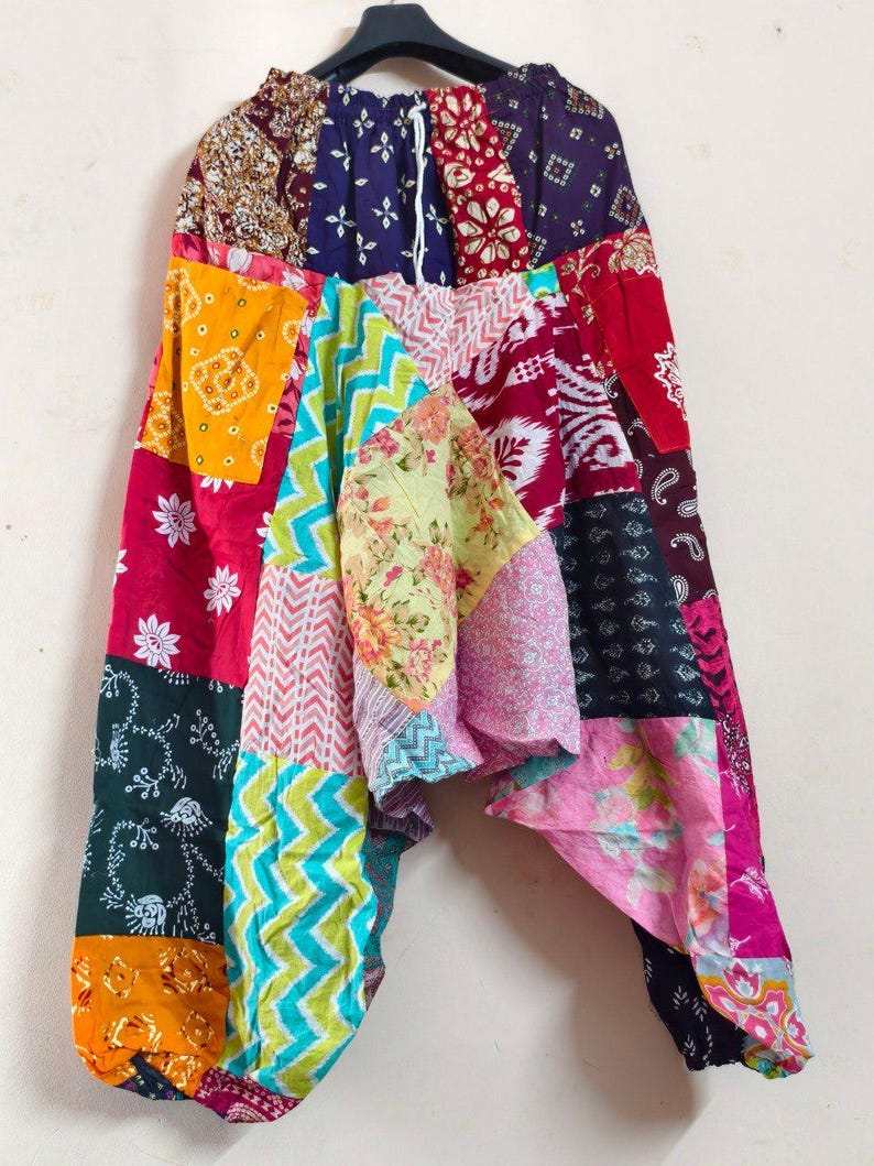 Merzouga Shopping Aladdin pants featuring colorful patchwork with floral, paisley, and geometric patterns in lightweight cotton blend
