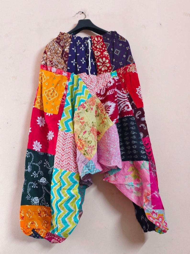 Merzouga Shopping Aladdin pants in colorful patchwork cotton fabric with mixed patterns and wide harem silhouette