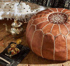 Moroccan pouf in rich brown leather with white stitched geometric pattern and central star design, handmade ottoman