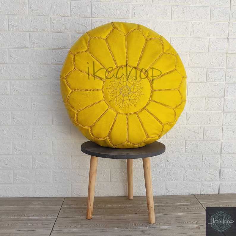 Moroccan pouf in bright yellow leather with traditional hand-stitched floral pattern and zipper closure