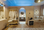 Nasser Palace Suites & Spa cozy room with beige walls, wooden flooring, white bathrobes, and modern Moroccan decor