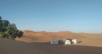 Sahara Trek Camp with white traditional tents set on golden sand dunes under a clear blue sky in Merzouga desert