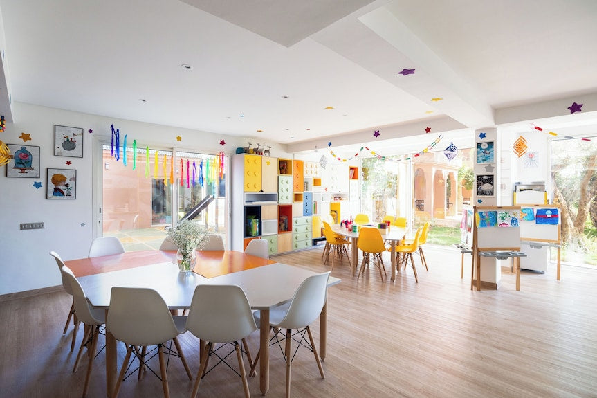 Bright children’s playroom at Sofitel Marrakech Palais Imperial & Spa with colorful furniture, wooden flooring, and large windows