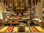 Sofitel Marrakech Palais Imperial & Spa restaurant buffet with Moroccan-style ceramic bowls, jars, and gold-toned hanging lights