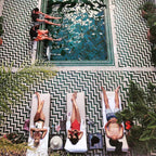 The Central House Marrakech Medina outdoor pool with geometric patterned tile floor and sun loungers surrounding the water