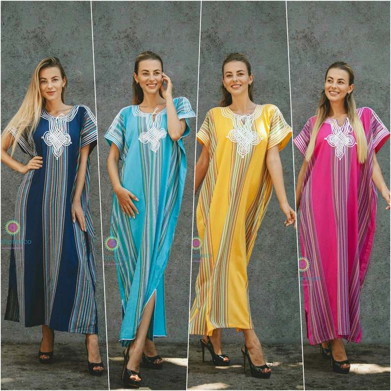 Four traditional Moroccan kaftan dresses in navy blue, turquoise, yellow, and pink cotton with multicolored vertical stripes and white silk embroidery on the chest.