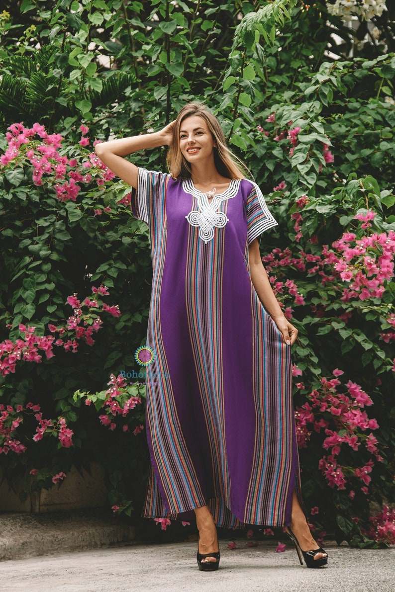 Purple cotton traditional Moroccan kaftan with multicolored vertical stripes and white silk embroidery on the neckline and sleeves.