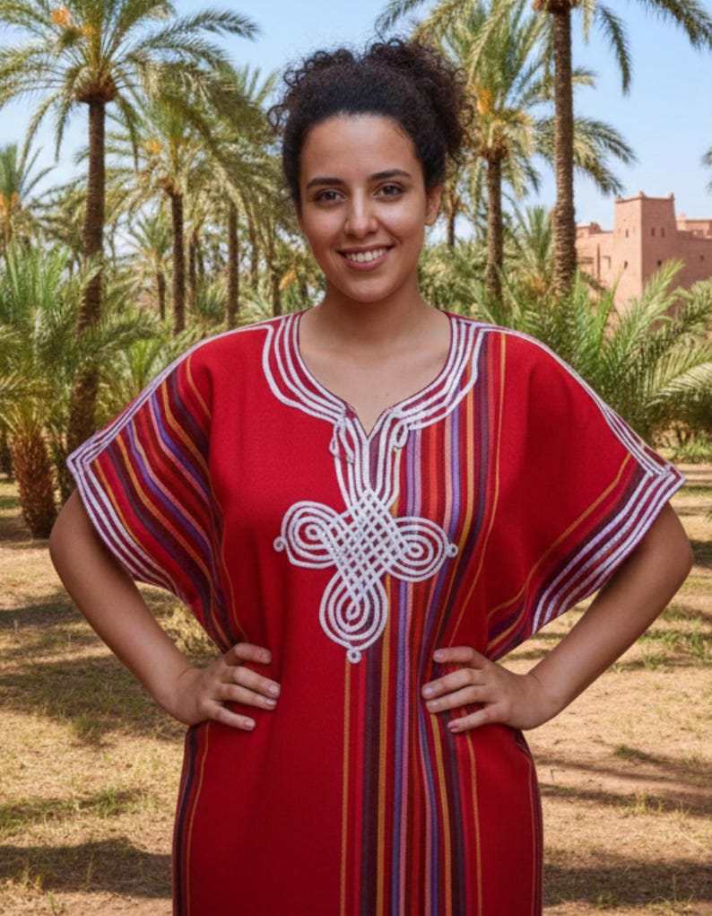 traditional Moroccan kaftan in red cotton with multicolored vertical stripes and white silk embroidery on the chest and neckline